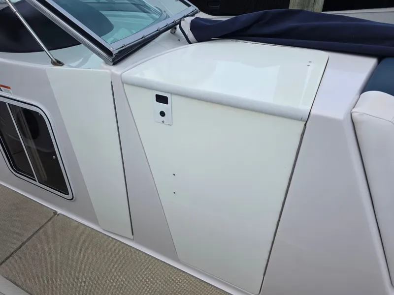 Slide: The Image of 2013 Four Winns H310 boat deck and window. - 30