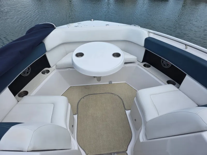 Slide: The Image of Interior of a 2013 Four Winns H310 boat on the water. - 32