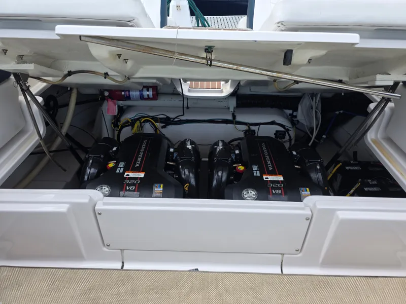 Slide: The Image of Engine compartment of a 2013 Four Winns H310 boat. - 36
