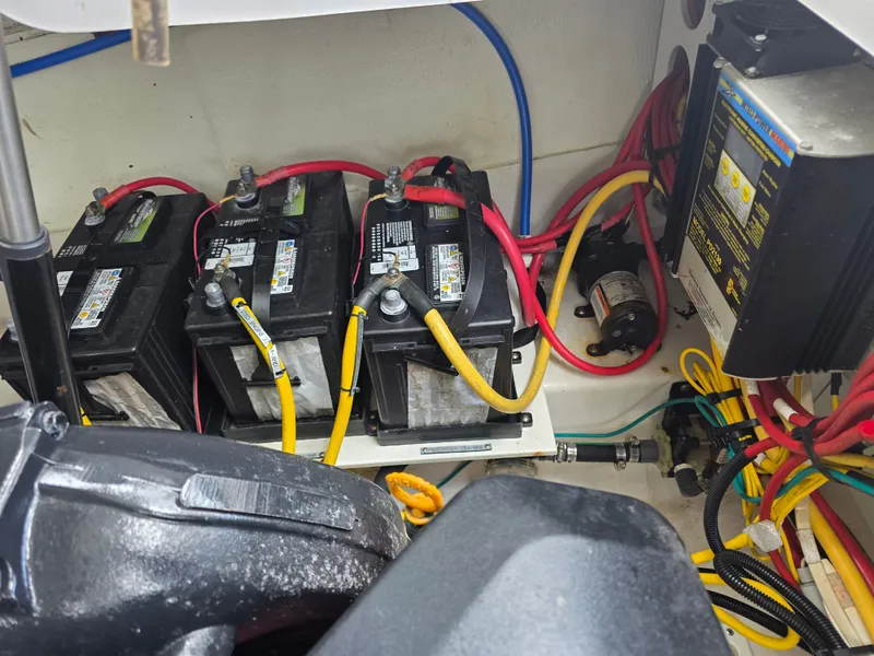 Slide: The Image of Batteries and wiring in a 2013 Four Winns H310 boat. - 40