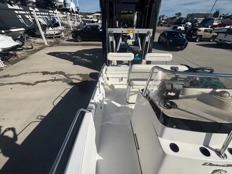 Slide: The Image of Boston Whaler 180 Dauntless 2000 on an outdoor boat lift. - 15