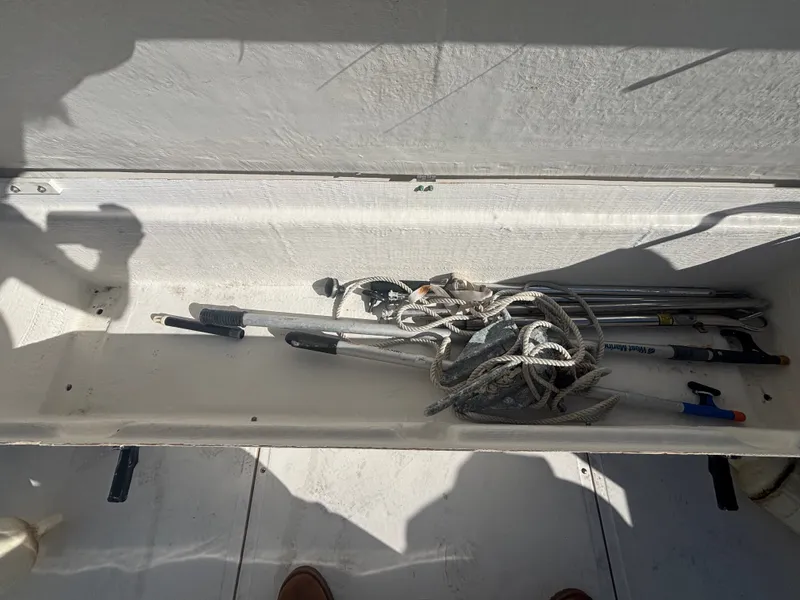Slide: The Image of Storage compartment in a 2000 Boston Whaler 180 Dauntless boat. - 19