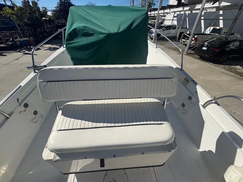 Slide: The Image of Boston Whaler 180 Dauntless 2000 with green cover detail. - 8
