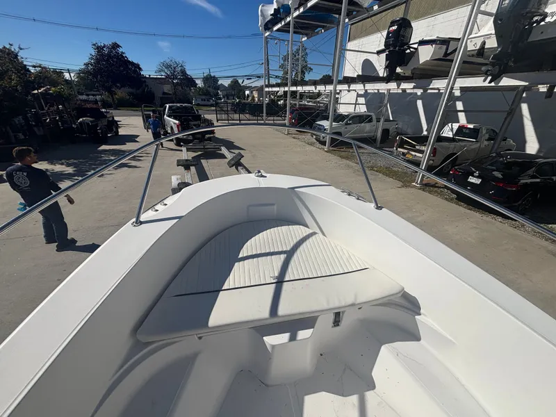 Slide: The Image of Boston Whaler 180 Dauntless 2000 parked at a boatyard. - 9