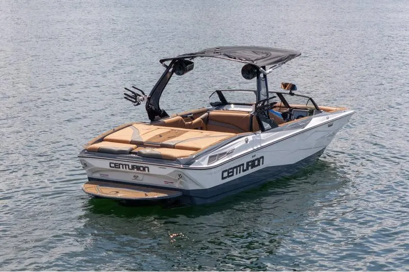 Slide: The Image of 2025 Centurion Nv233 boat on water, featuring sleek design and modern amenities. - 16