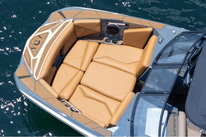 Slide: The Image of Luxurious seating on 2025 Centurion Nv233 boat, featuring tan upholstery and sleek design. - 22
