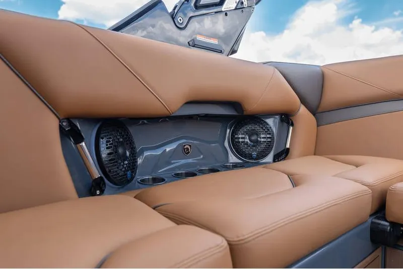 Slide: The Image of Luxurious brown leather seating with built-in speakers in a 2025 Centurion Nv233 boat. - 26