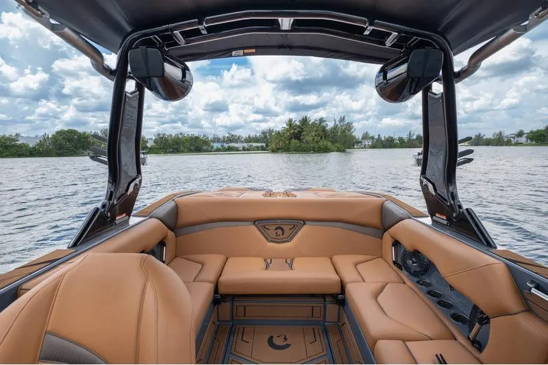 Slide: The Image of Luxurious interior of 2025 Centurion Nv233 boat on a scenic lake. - 28