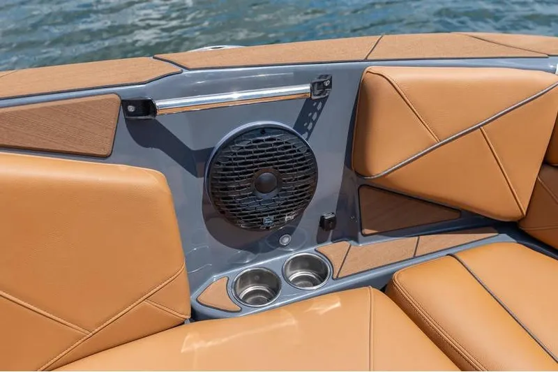 Slide: The Image of Centurion Nv233 2025 boat interior with tan leather seats and built-in speaker system. - 35