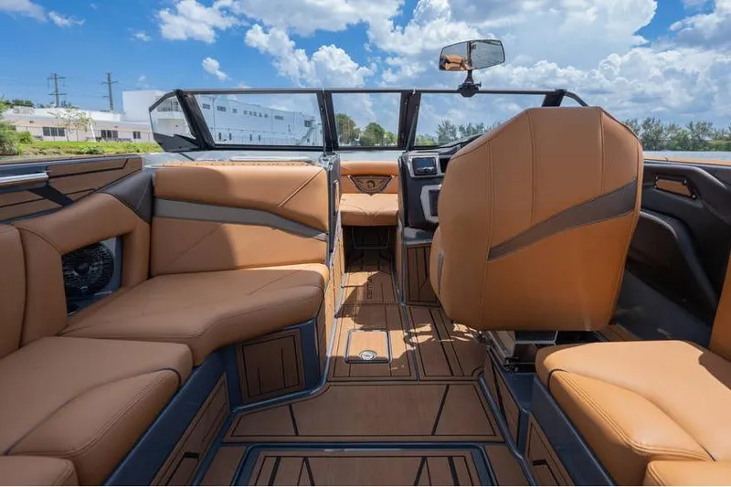 Slide: The Image of Luxurious interior of 2025 Centurion Nv233 boat with tan leather seating. - 37