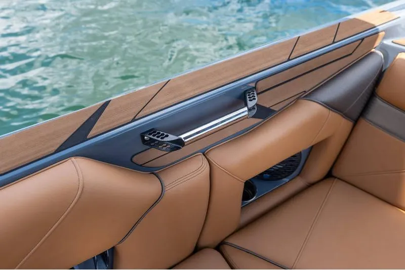 Slide: The Image of Luxurious interior of 2025 Centurion Nv233 boat with tan leather seating. - 38