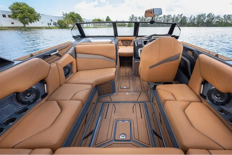 Slide: The Image of Luxurious interior of 2025 Centurion Nv233 boat with tan leather seating and modern design. - 41