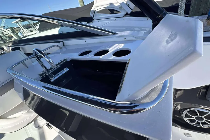 Slide: The Image of 2018 Monterey 278SS Super Sport boat interior with sink and cup holders. - 12
