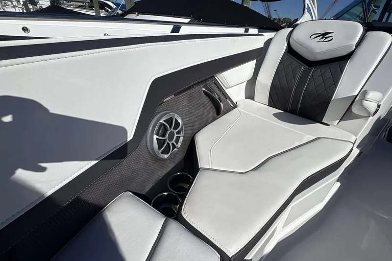 Slide: The Image of Luxurious seating in 2018 Monterey 278SS Super Sport boat with speaker and cup holders. - 14