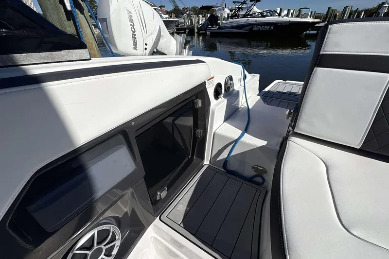 Slide: The Image of 2018 Monterey 278SS Super Sport boat interior with seating and docked view. - 18