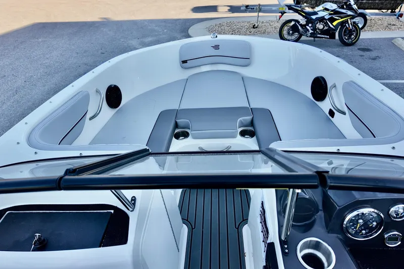 Slide: The Image of 2025 Bayliner VR4 Bowrider OB interior with seating and dashboard view. - 13