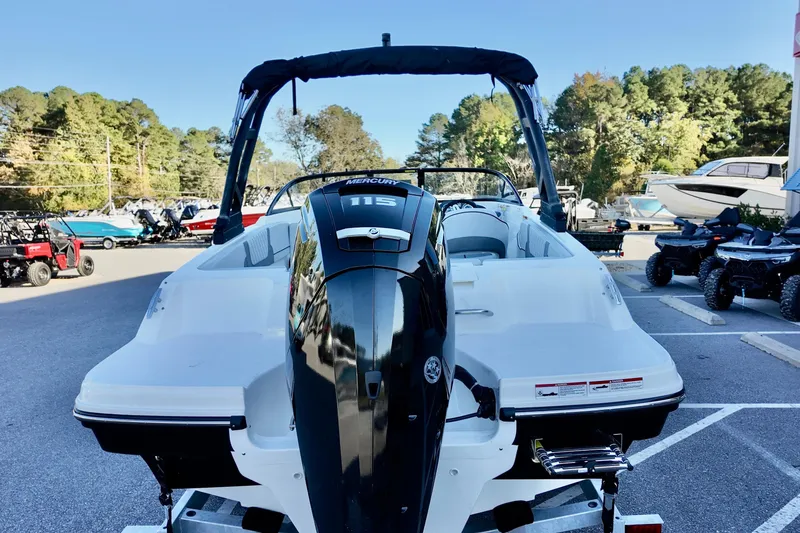 Slide: The Image of 2025 Bayliner VR4 Bowrider OB with Mercury 115 engine, parked outdoors. - 14
