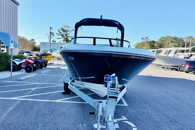 Slide: The Image of 2025 Bayliner VR4 Bowrider OB on trailer in parking lot, front view. - 5