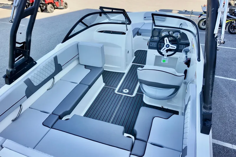 Slide: The Image of 2025 Bayliner VR4 Bowrider OB interior with modern seating and sleek dashboard design. - 6