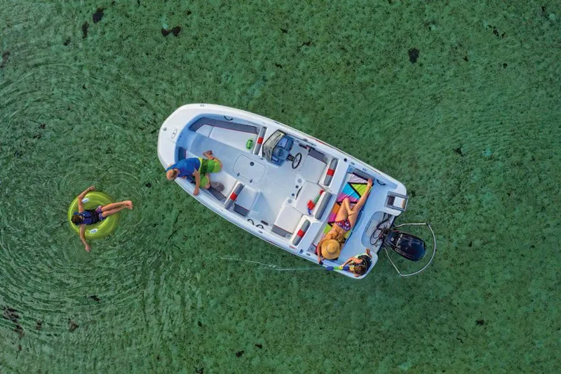 Slide: The Image of 2020 Tahoe T16 boat interior with white and gray seating. - 10