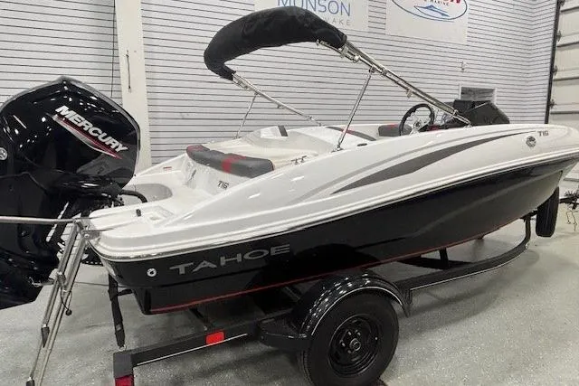 Slide: The Image of 2020 Tahoe T16 boat with Mercury engine on trailer in showroom. - 2