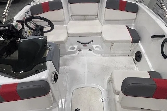 Slide: The Image of Interior of a 2020 Tahoe T16 boat with sticker-decorated dashboard and steering wheel. - 23