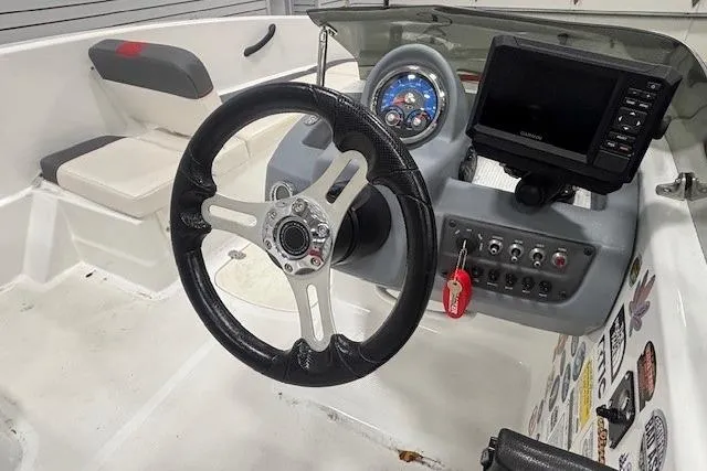 Slide: The Image of Garmin fishfinder display showing depth and sonar readings on a 2020 Tahoe T16 boat. - 34