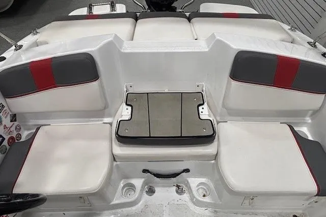 Slide: The Image of 2020 Tahoe T16 boat interior with cushioned seating and motor detail. - 36
