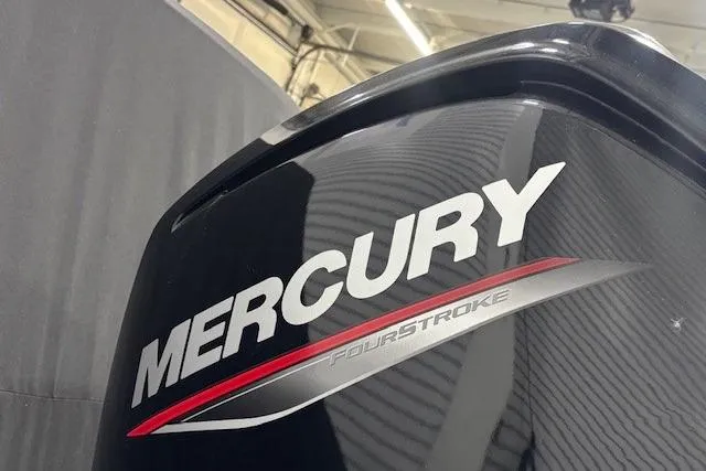 Slide: The Image of 2020 Tahoe T16 boat interior with white and gray seating, steering wheel, and red accents. - 37