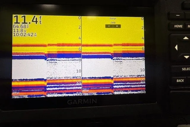 Slide: The Image of 2020 Tahoe T16 boat interior with white and gray seating, red accents. - 40