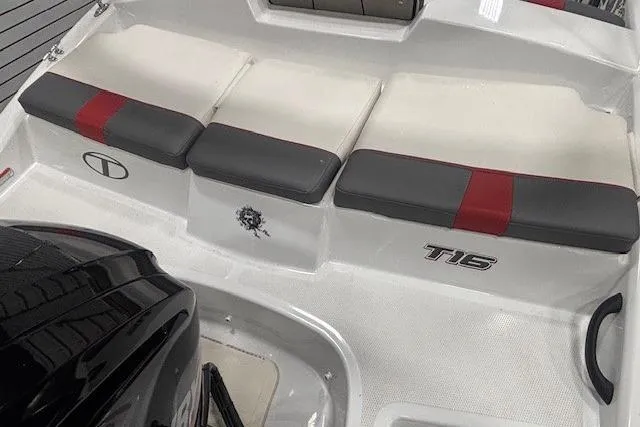 Slide: The Image of 2020 Tahoe T16 boat trailer with black wheel and red accent stripe. - 44