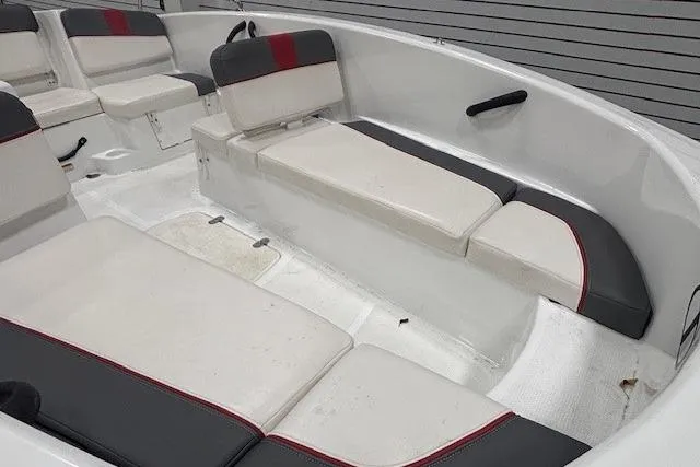 Slide: The Image of 2020 Tahoe T16 boat with Mercury engine, covered and on trailer in garage. - 49