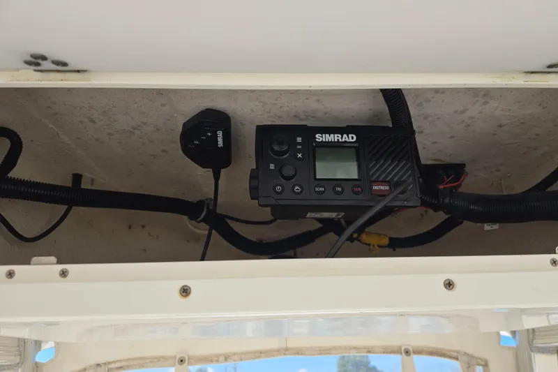 Slide: The Image of Simrad marine radio installed on 2017 Sea Hunt BX 25 BR boat dashboard. - 13