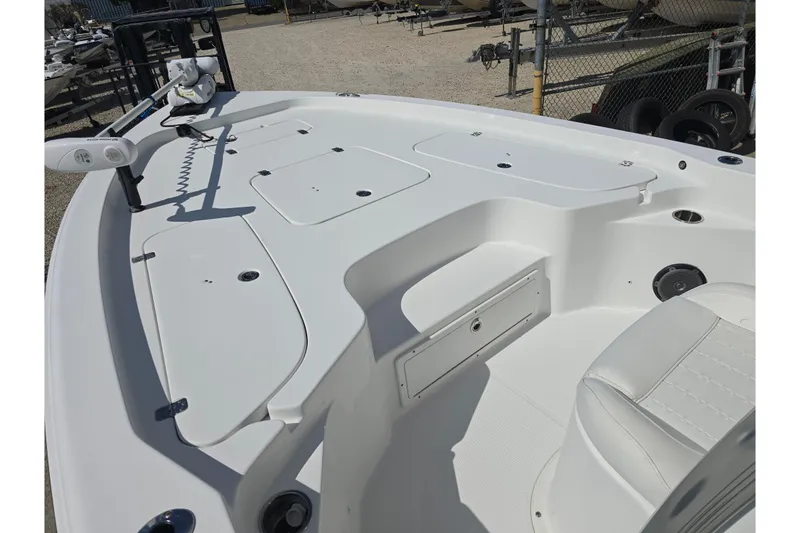 Slide: The Image of 2017 Sea Hunt BX 25 BR boat deck with seating and storage compartments. - 15