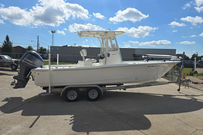 Slide: The Image of 2017 Sea Hunt BX 25 BR boat on trailer, parked outdoors under a clear sky. - 5