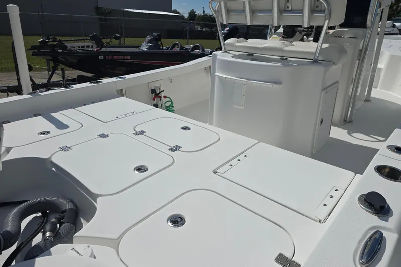 Slide: The Image of 2017 Sea Hunt BX 25 BR boat interior with storage compartments and seating. - 7