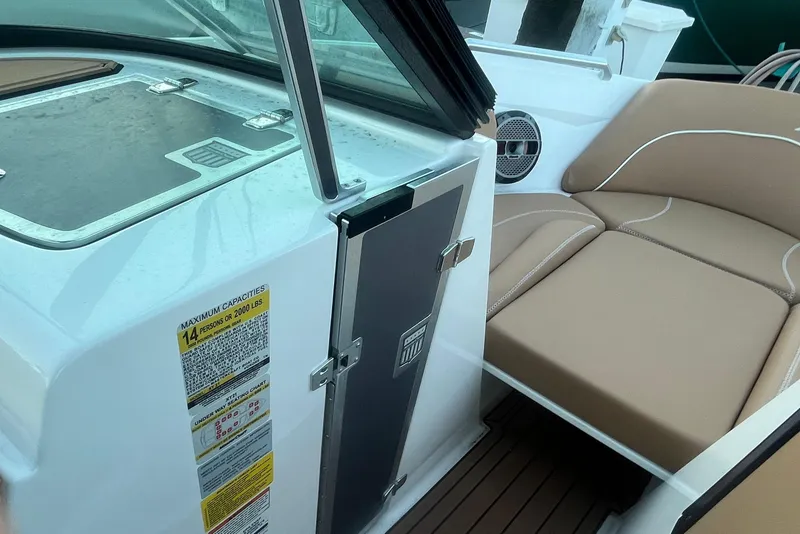 Slide: The Image of 2021 MasterCraft XT21 boat interior with seating and capacity label. - 27