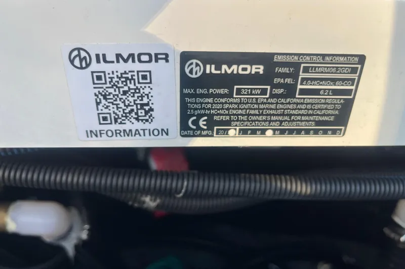 Slide: The Image of QR code and Ilmor engine information label on a 2021 MasterCraft XT21. - 32