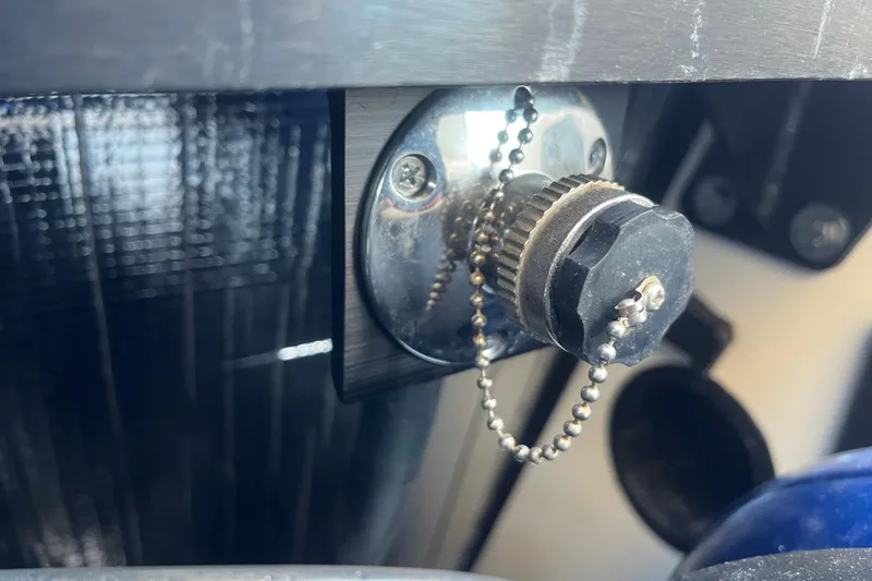 Slide: The Image of Close-up of a 2021 MasterCraft XT21 boat's metal component with a chain. - 33