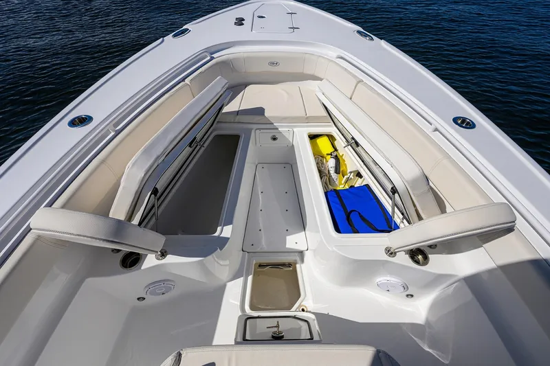 Slide: The Image of 2024 Sea Hunt Ultra 305 SE boat interior with open storage compartments. - 15