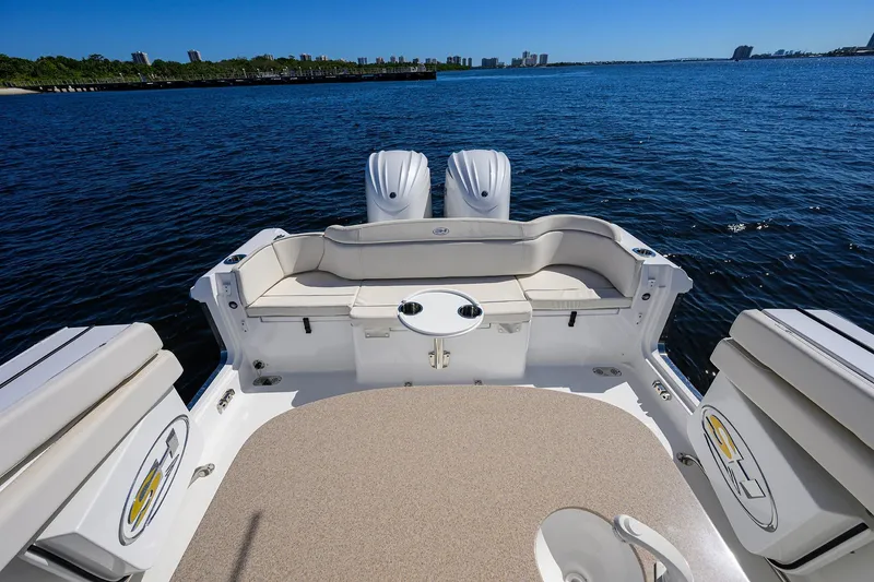 Slide: The Image of 2024 Sea Hunt Ultra 305 SE boat interior with seating, ocean view. - 29