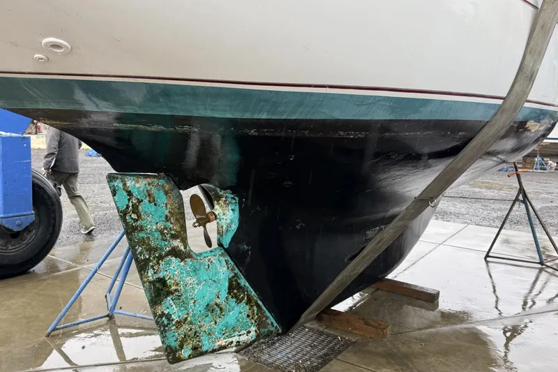 Slide: The Image of 1982 Cape Dory 33 sailboat hull and propeller in dry dock. - 16