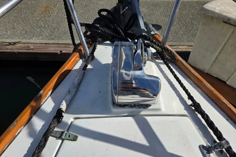 Slide: The Image of Bow of 1982 Cape Dory 33 sailboat with anchor windlass and ropes. - 3