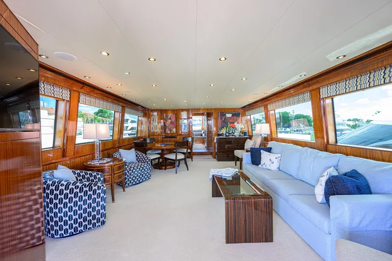 Slide: The Image of Luxurious interior of 2009 Hatteras Enclosed Bridge yacht with elegant seating and wood finishes. - 1