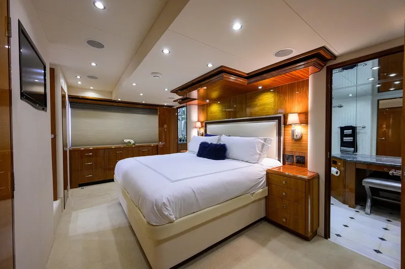 Slide: The Image of Luxurious bedroom interior of 2009 Hatteras Enclosed Bridge yacht with elegant wood finishes. - 20