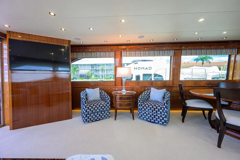 Slide: The Image of Luxurious interior of 2009 Hatteras Enclosed Bridge yacht with elegant seating and large windows. - 3