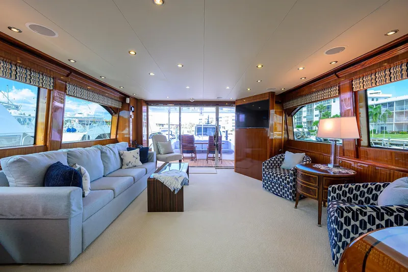 Slide: The Image of Luxurious interior of 2009 Hatteras Enclosed Bridge yacht with elegant seating and large windows. - 5