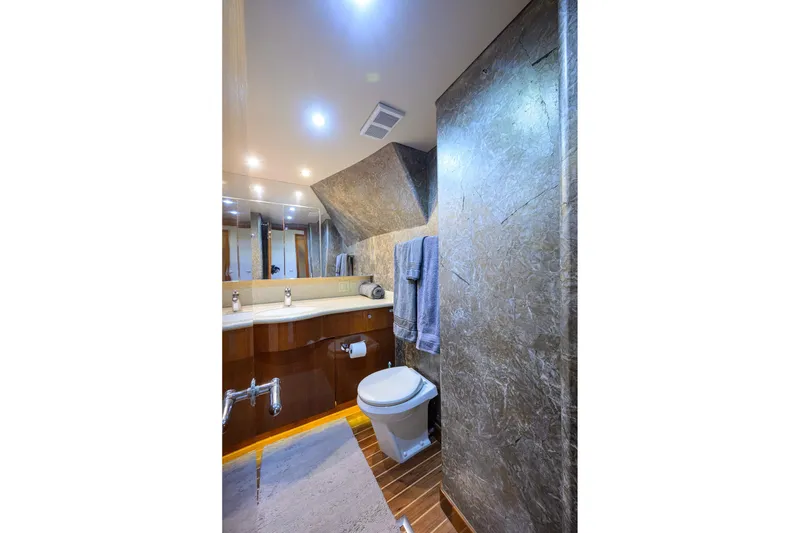 Slide: The Image of Luxurious bathroom in 2009 Hatteras Enclosed Bridge yacht with modern fixtures and elegant design. - 57