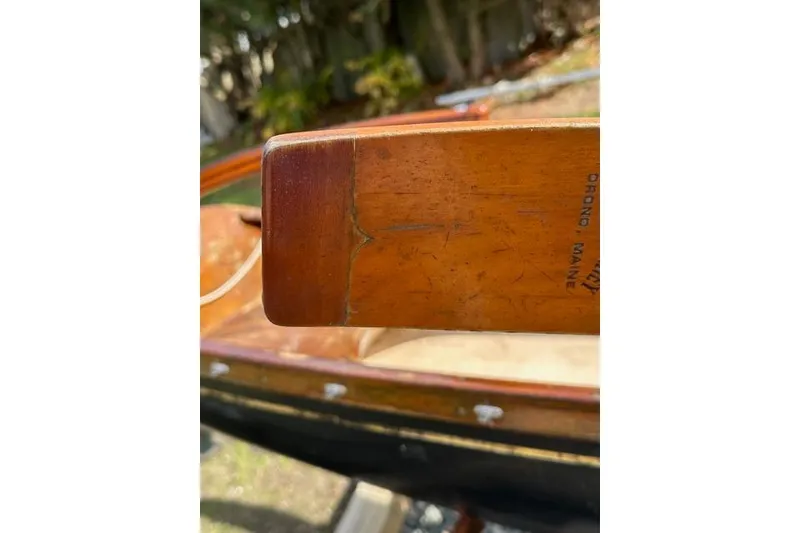 Slide: The Image of 1974 Jarvis Newman rowing/sailing dinghy, wooden detail, close-up view. - 5