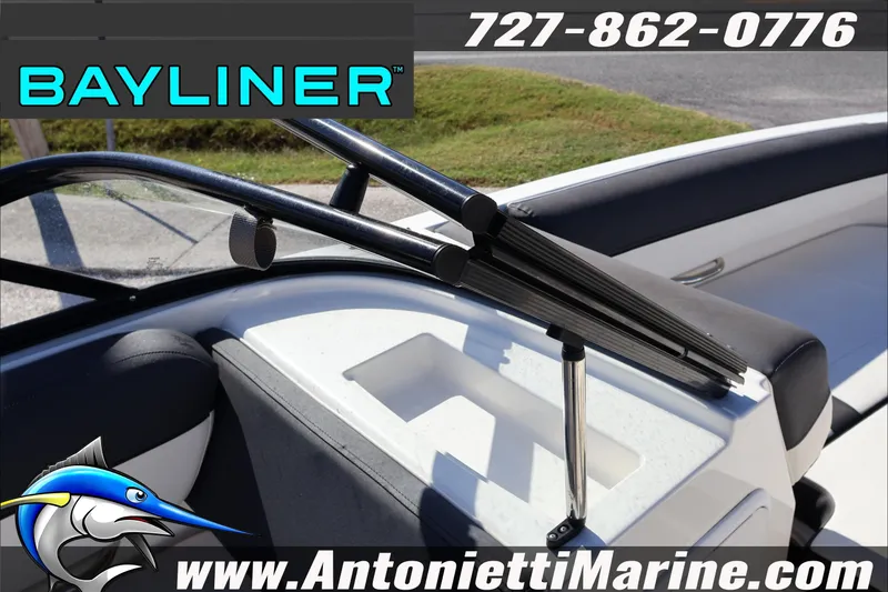 Slide: The Image of 2023 Bayliner DX 2000 boat interior with seating and windshield wiper detail. - 15